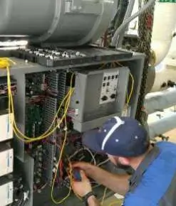 A tech working on wiring.