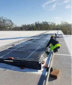 Air Services Unlimited service techs on a roof doing an install.