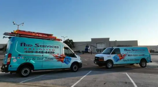 A couple of Air Services Unlimited service vans.